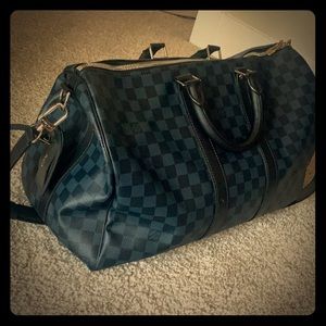 Medium sized Louis Vuitton duffel bag